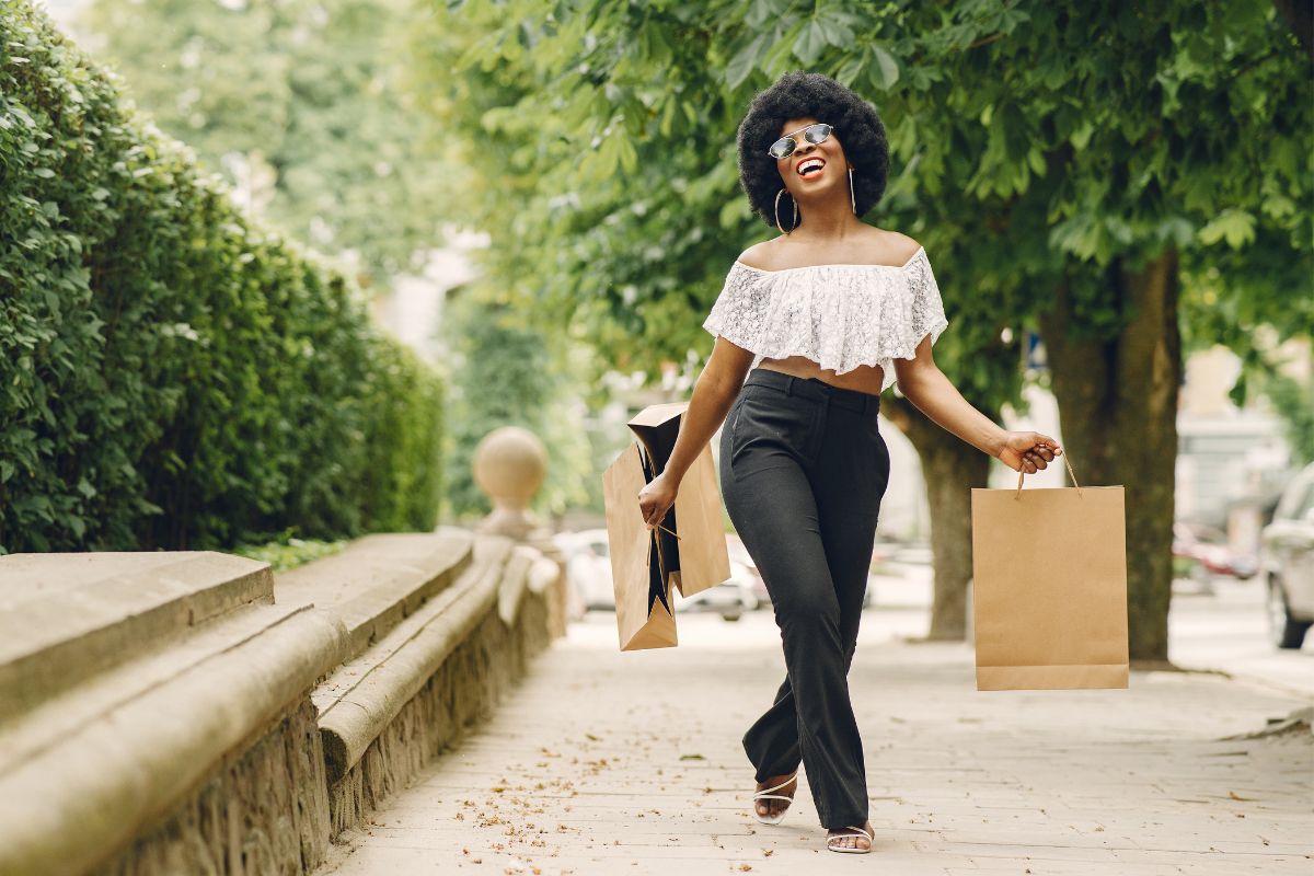 A picture of someone walking after shopping. 