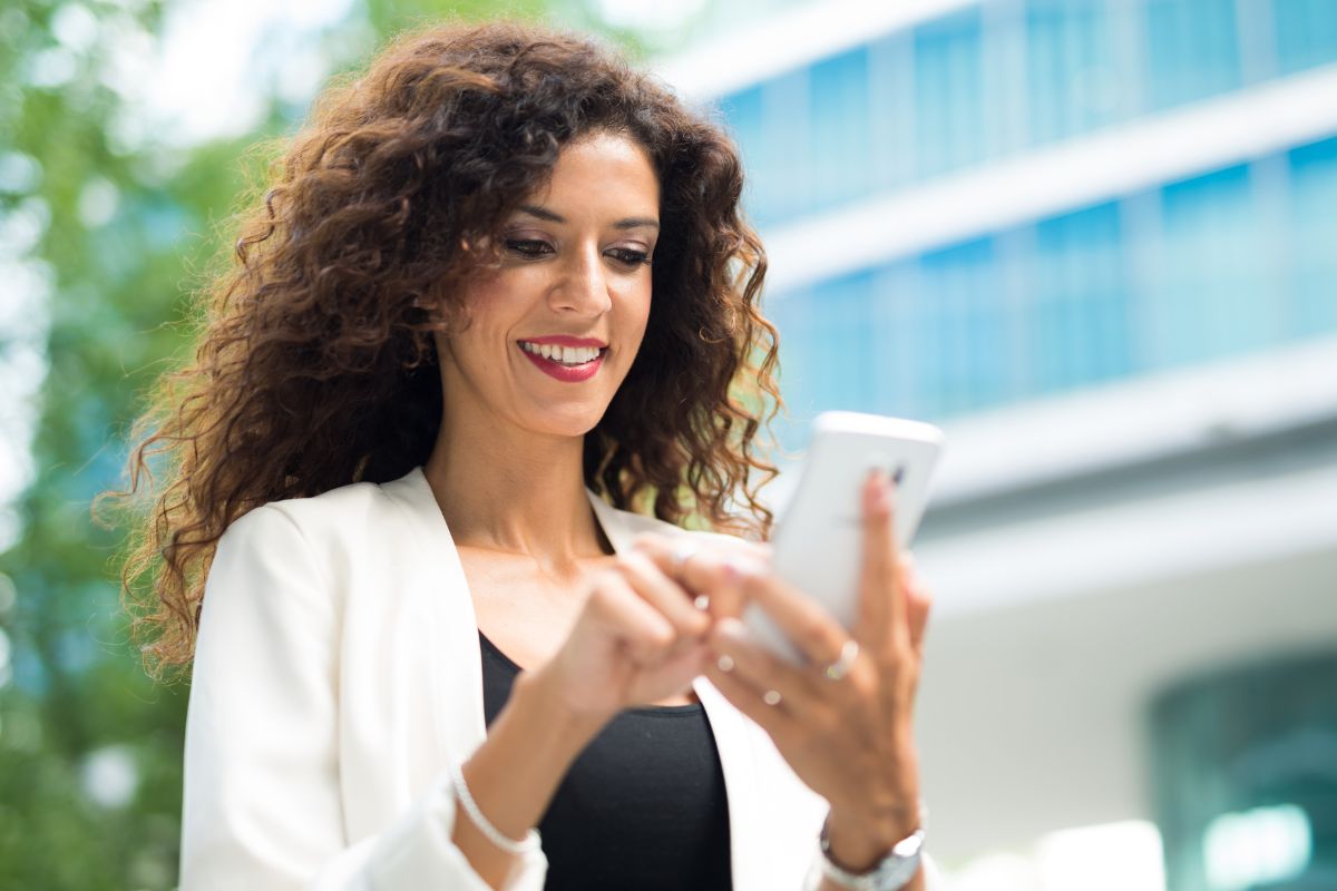 A picture of someone looking at their smarrtphone.