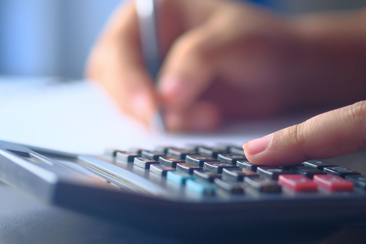 A picture of someone calculating. 