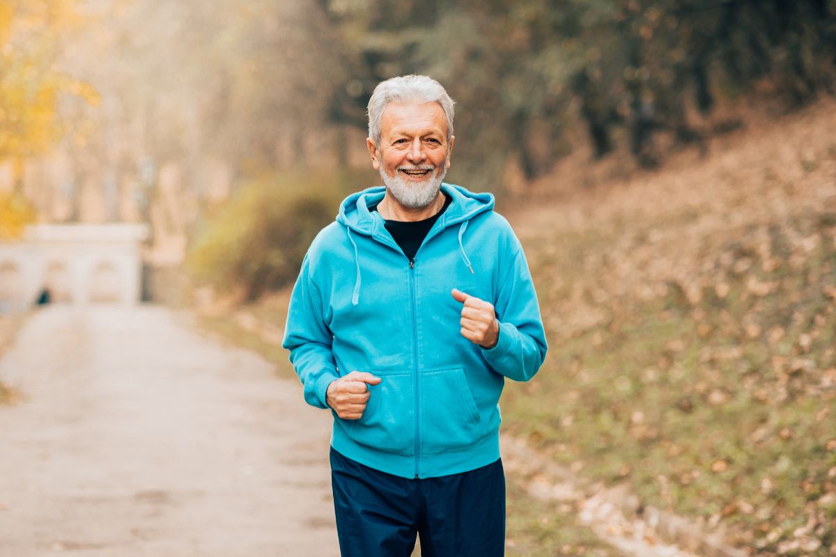 A picture of an old man jogging. 