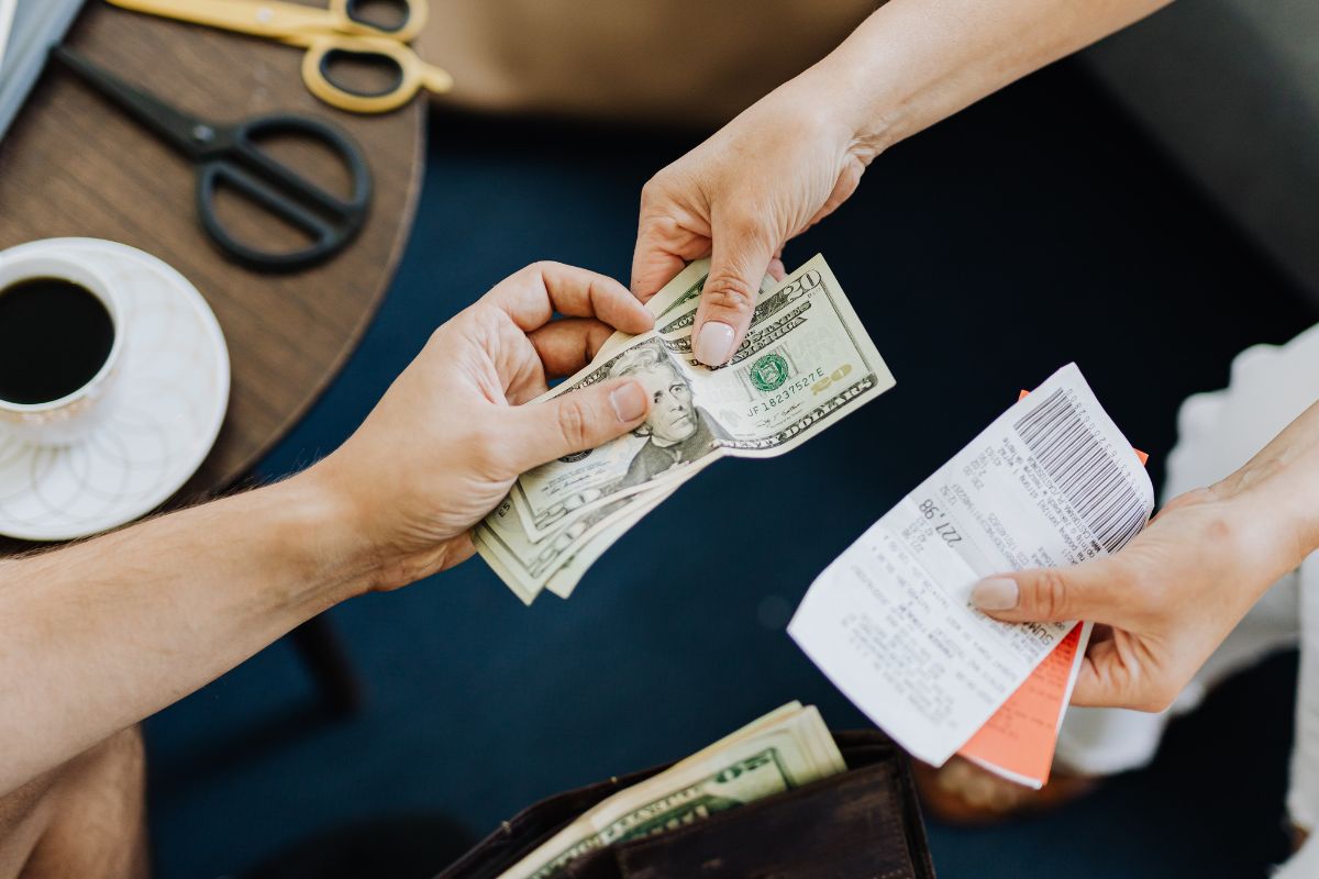 A picture of someone paying something. 