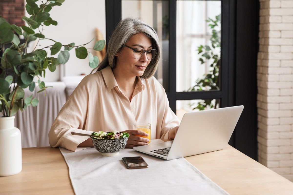 A picture of someone searching up something in her laptop. 