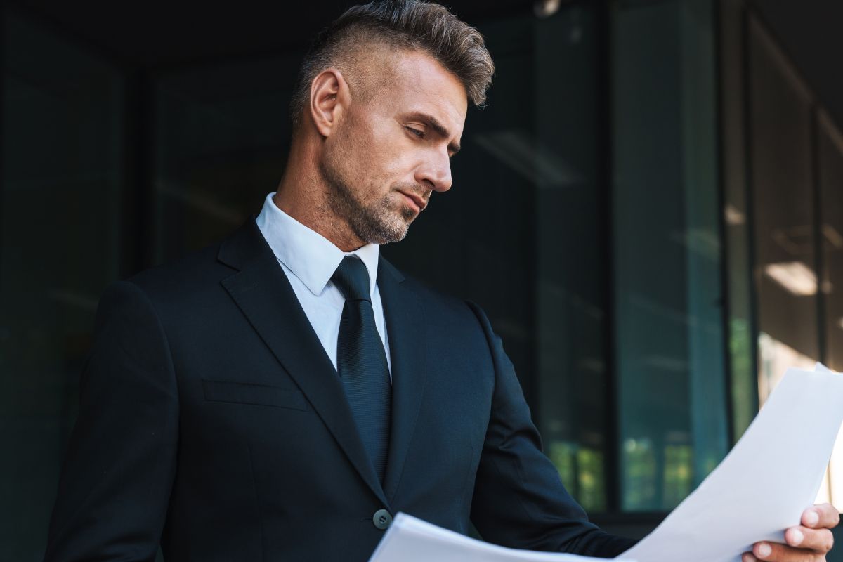 A picture of someone looking at papers. 
