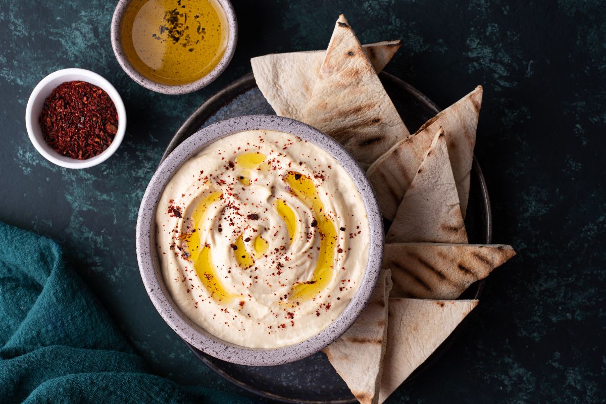 A picture of Hummus and veggie pita pockets.
