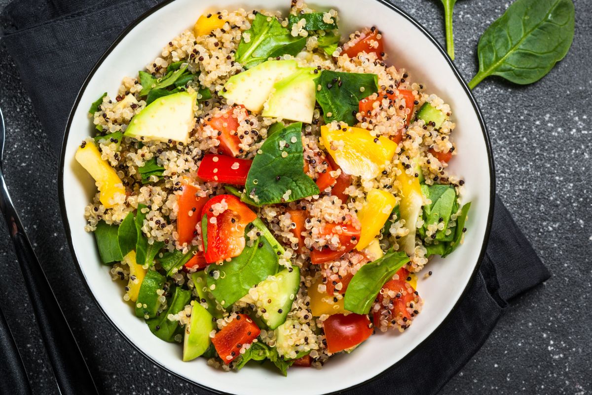 A picture of Cold quinoa bowl with chopped veggies.