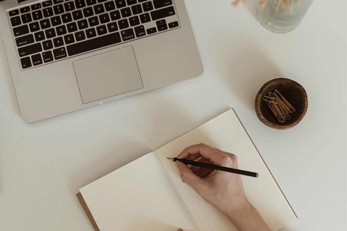A picture of someone writing. 
