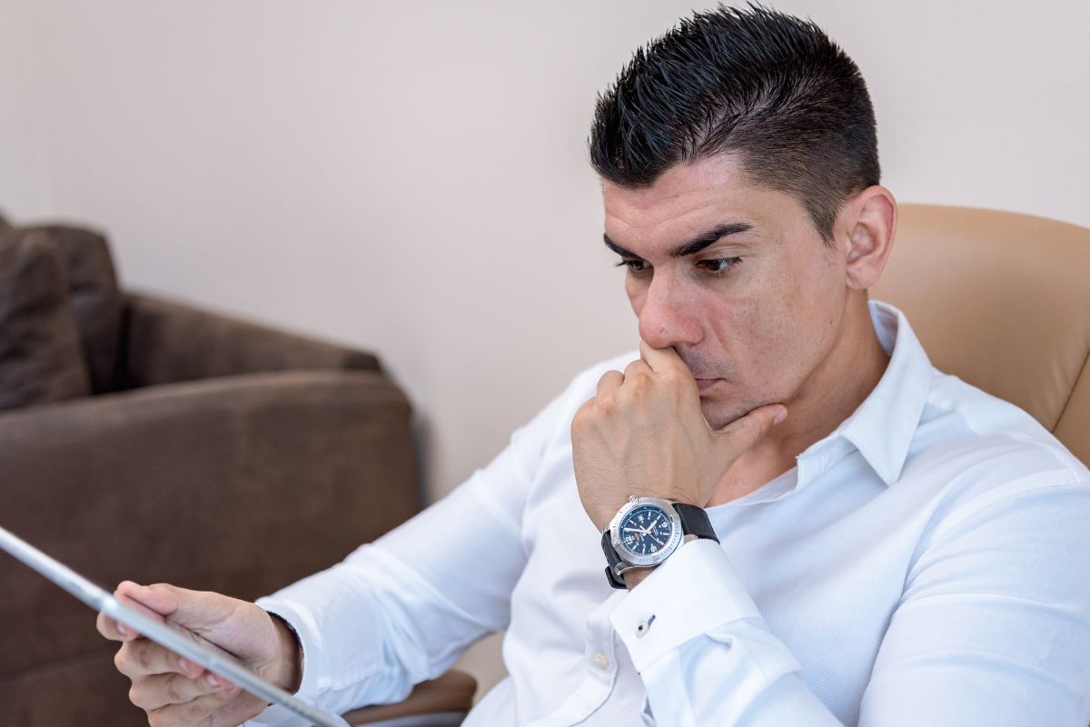 A picture of someone looking at their gadget. 
