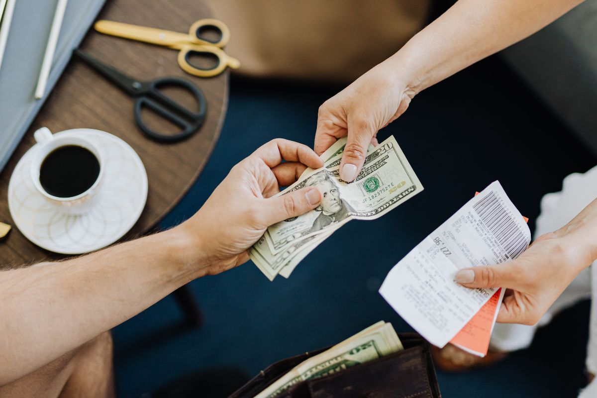 A picture of someone paying debt. 
