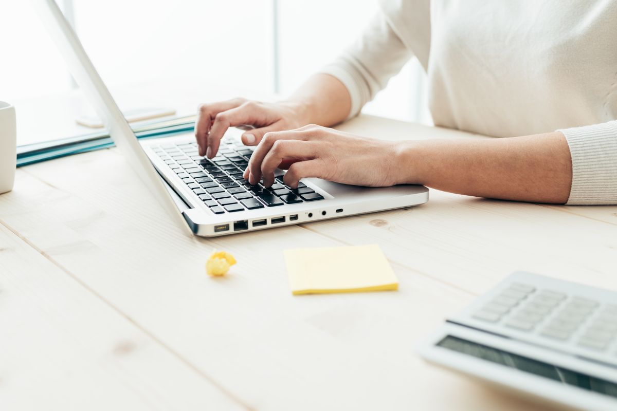 A picture of someone typing something down. 