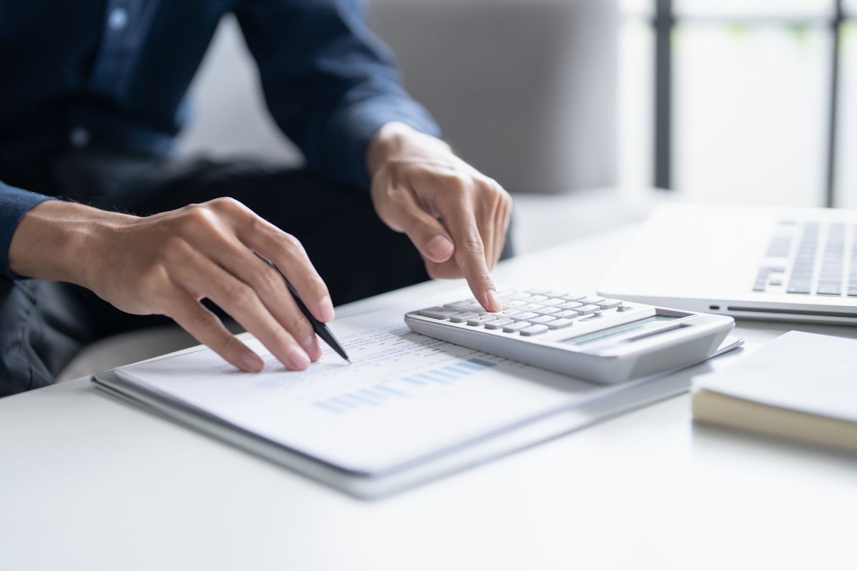A picture of someone calculating something. 