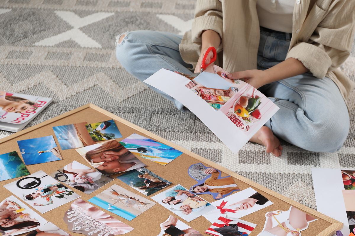 A picture of someone making a vision board. 