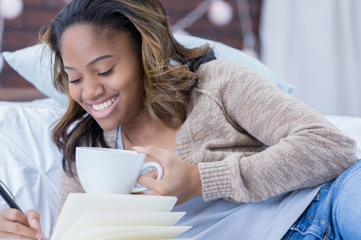 A picture of someone writing down something. 