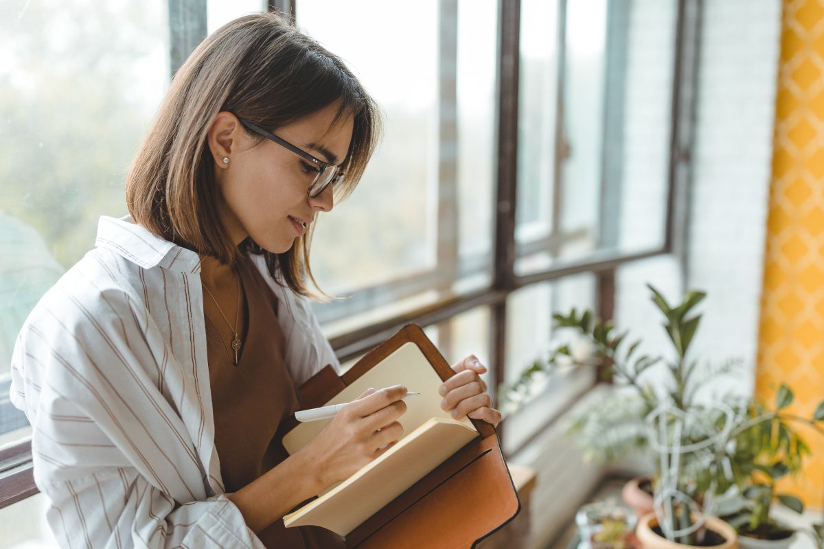 A picture of someone writing. 