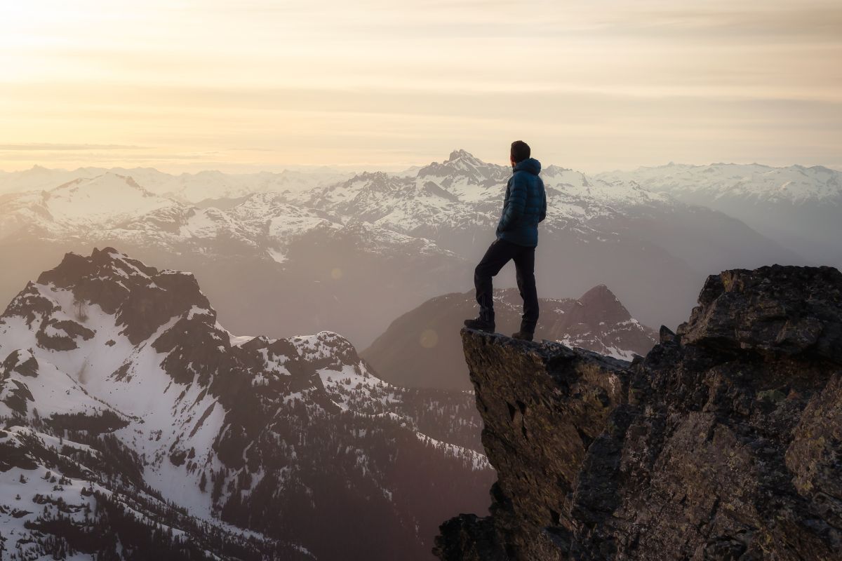 A picture of someone on top of a mountain. 