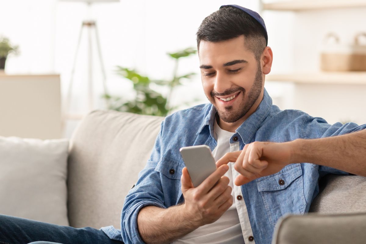 A picture of someone with their phone. 