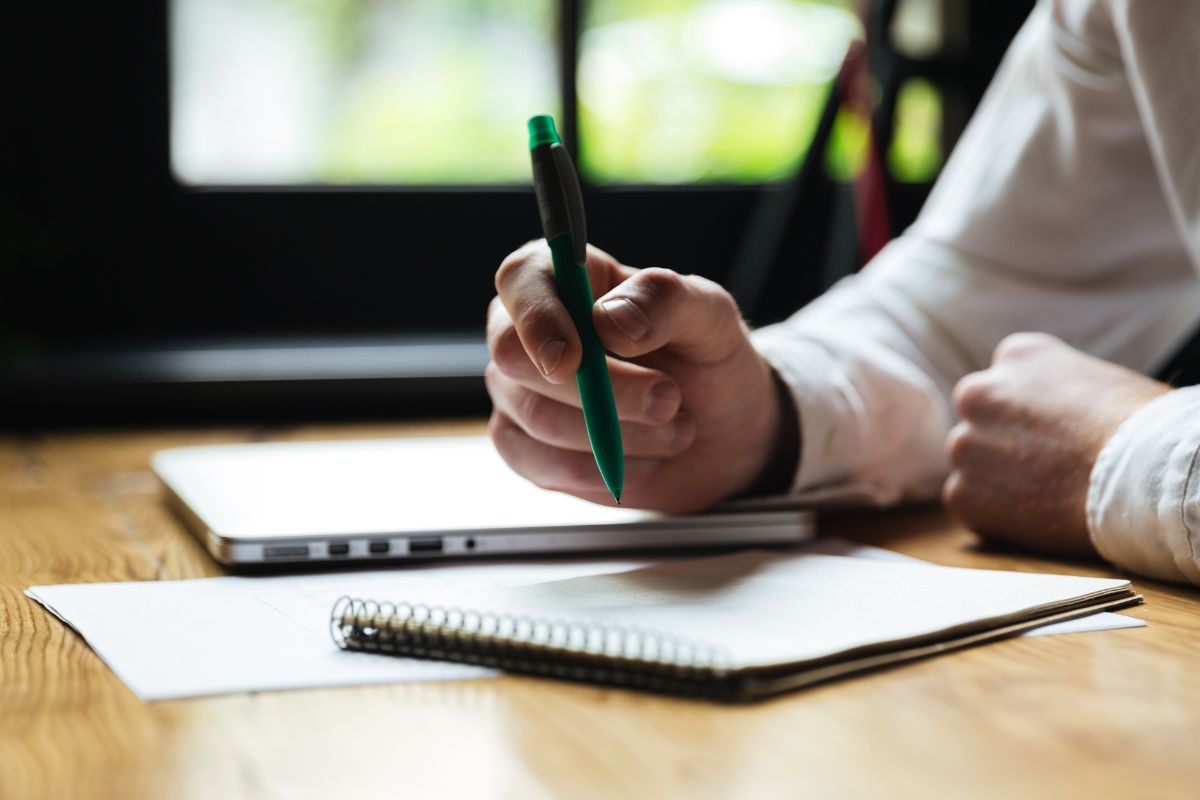 A picture of someone writing. 