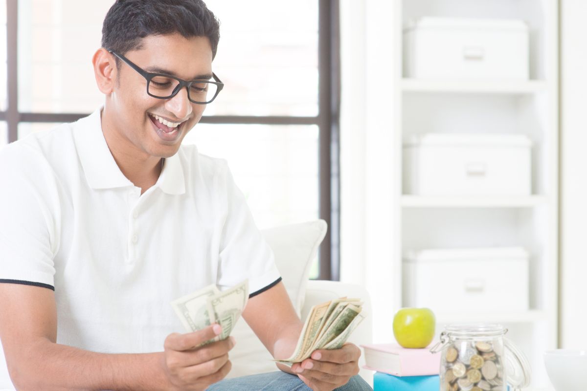 A picture of someone counting money. 