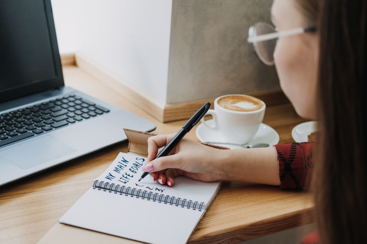 A picture of someone writing something. 