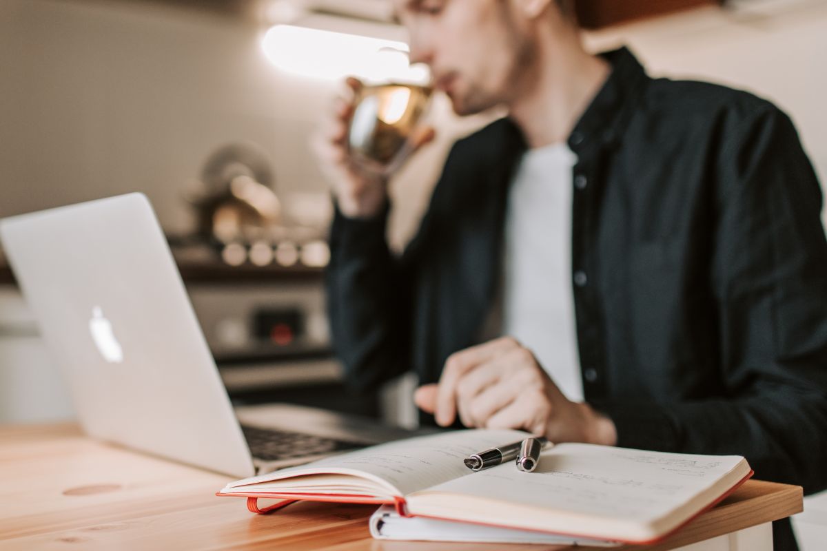 A picture of someone using their laptop. 
