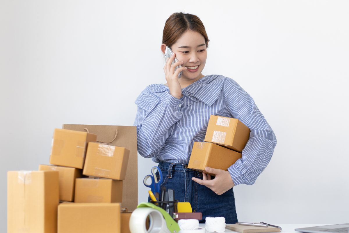 A picture of a lady calling someone. 