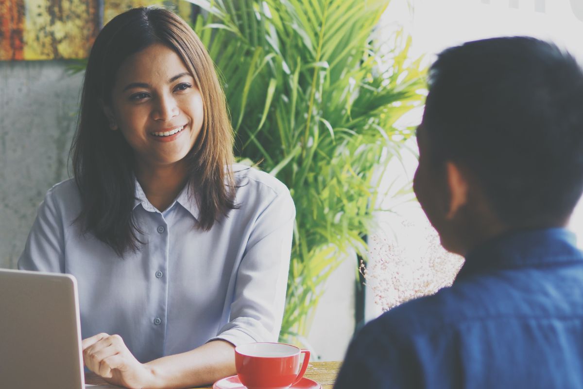 A picture of two people talking. 