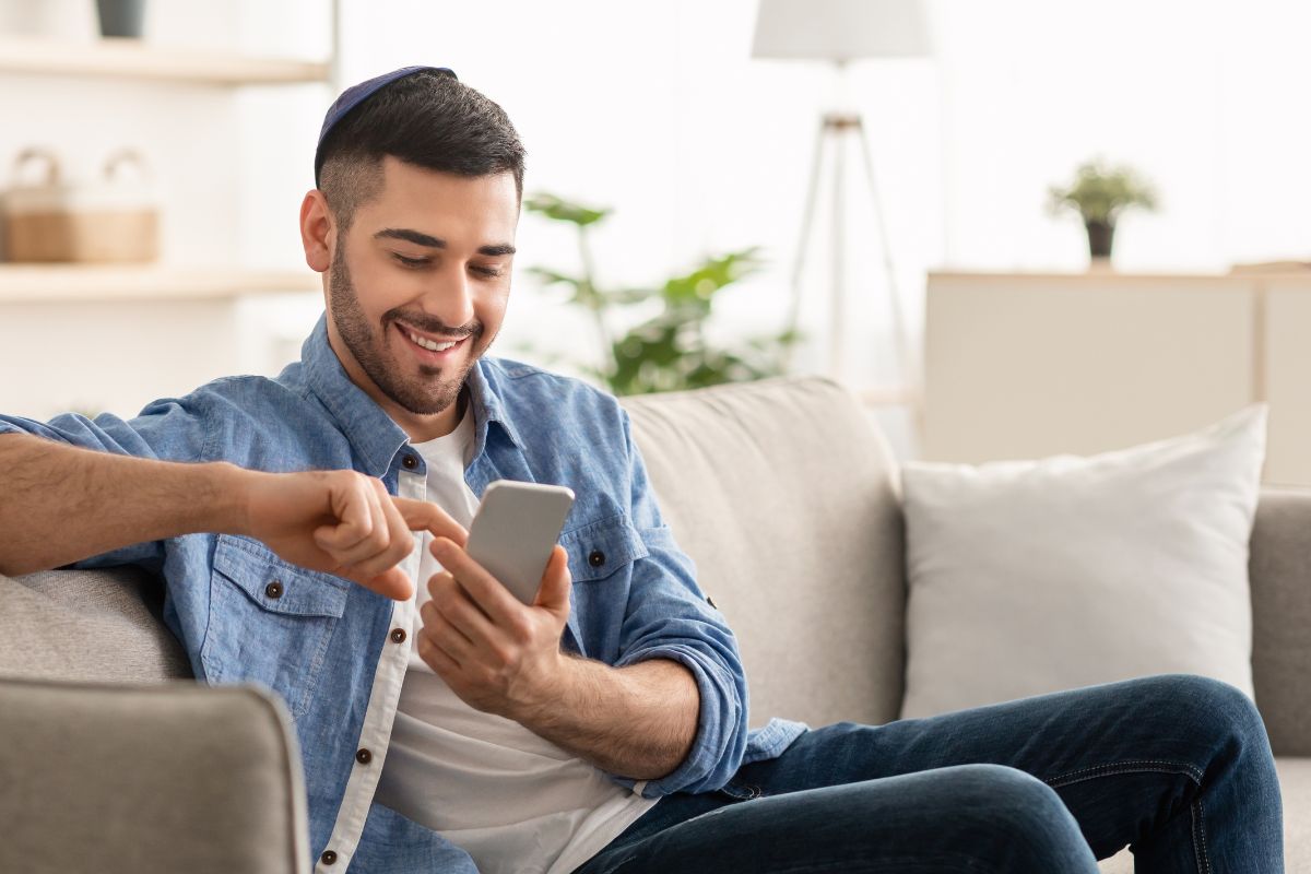 A picture of someone looking at his phone. 