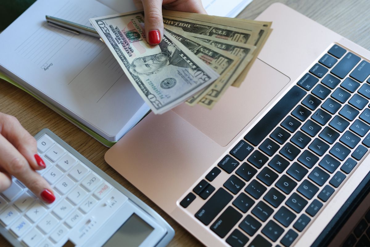 A picture of someone counting money. 