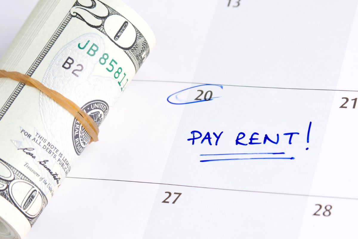 A picture of someone paying rent. 