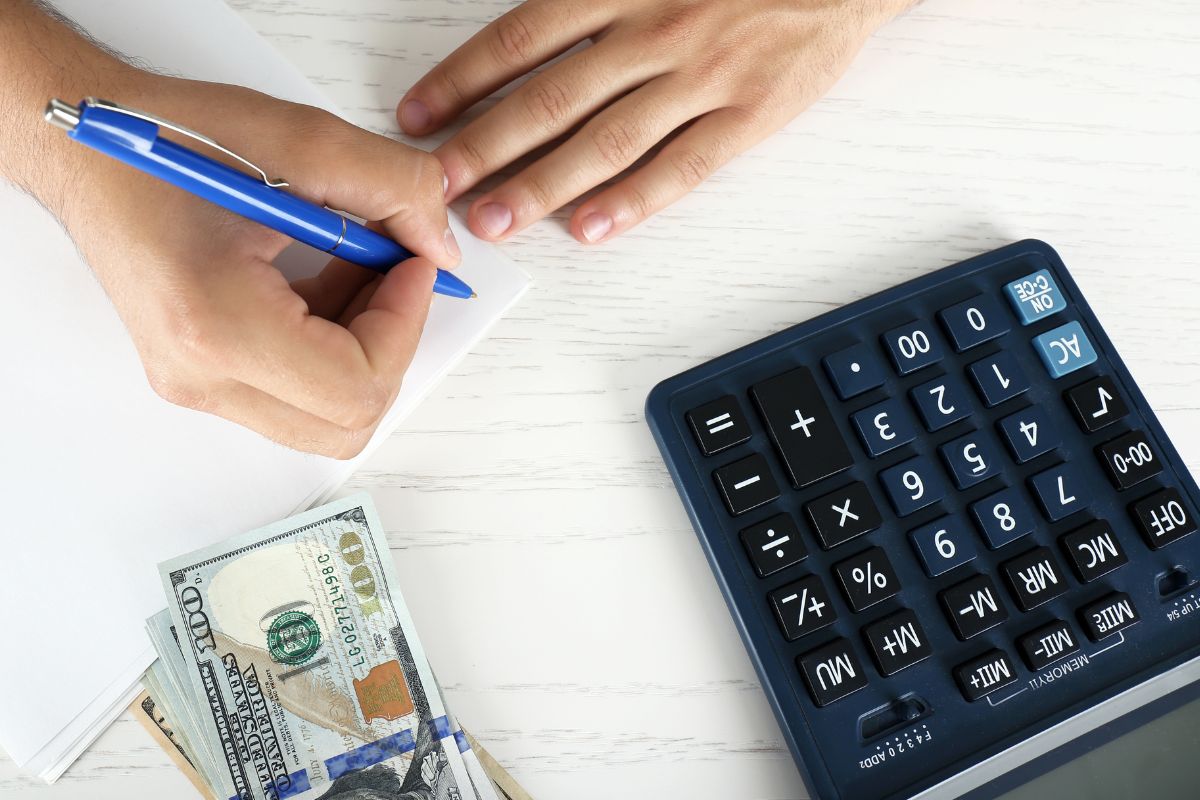 A picture of someone budgeting their money. 