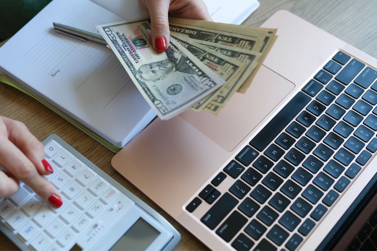 A picture of someone counting their money. 