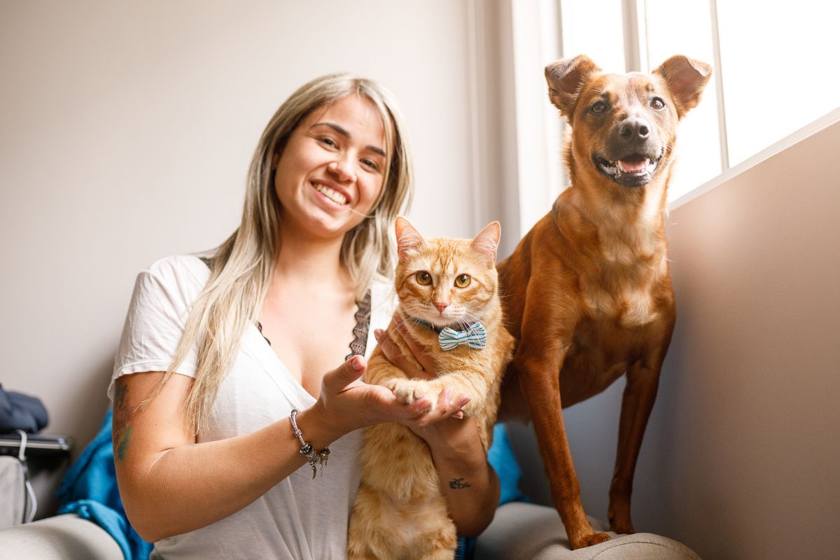 Picture of a lady pet sitting animals.