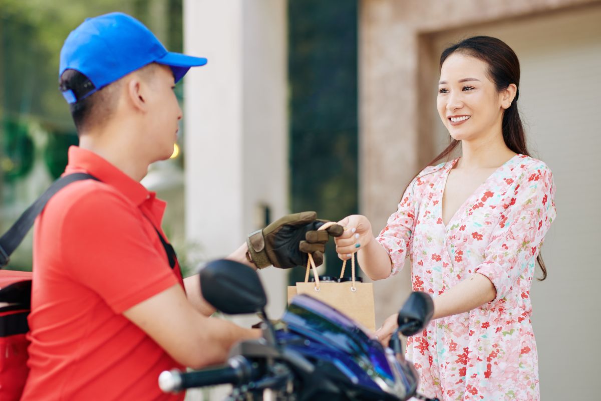 A picture of someone delivering goods.