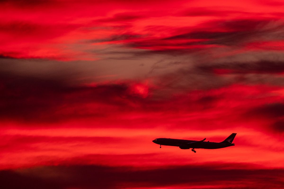 A picture of a flight in the early morning. 