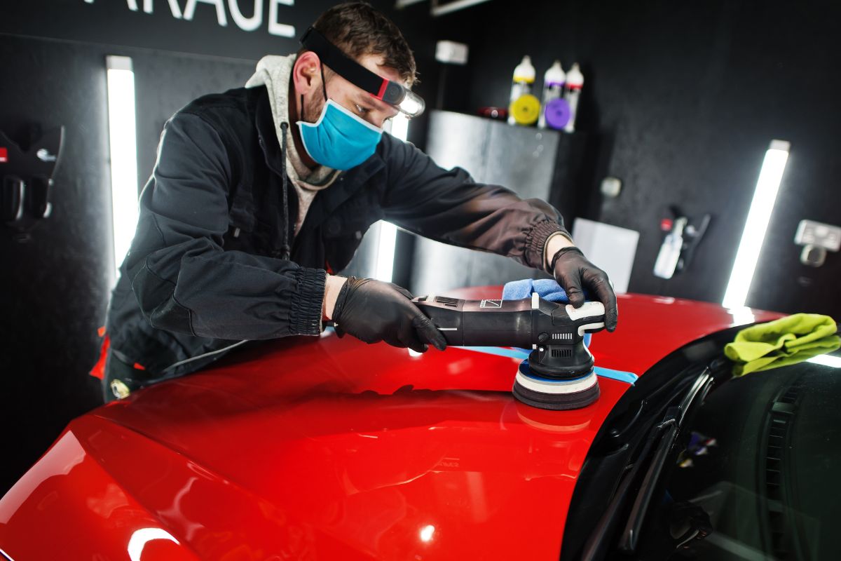 A picture of someone doing car detailing.