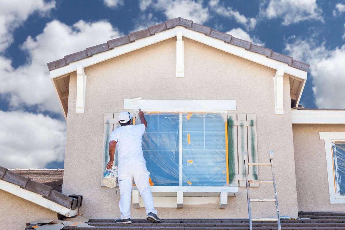 A picture of a house being painted. 