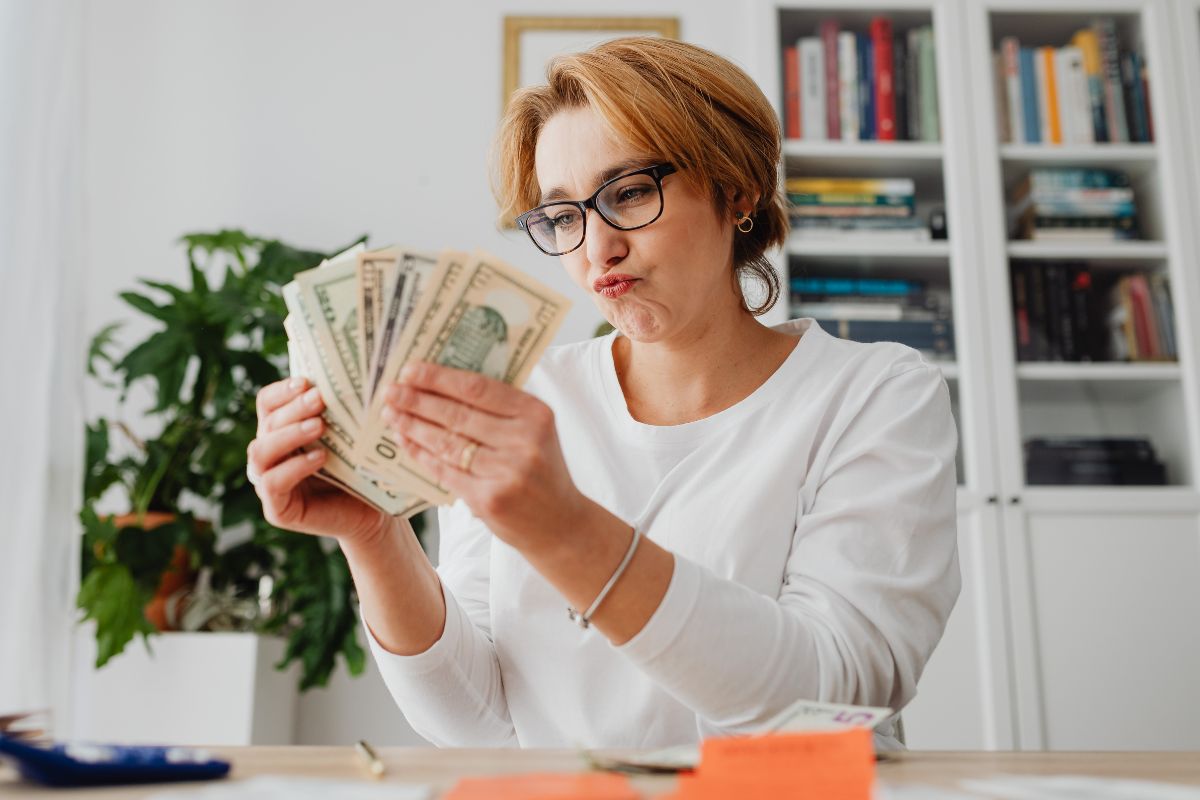 A picture of someone counting money.