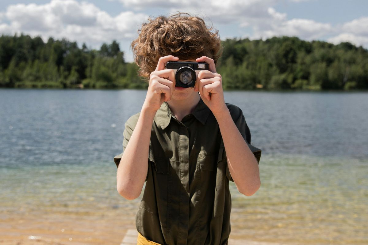 A picture of a child taking a picture. 