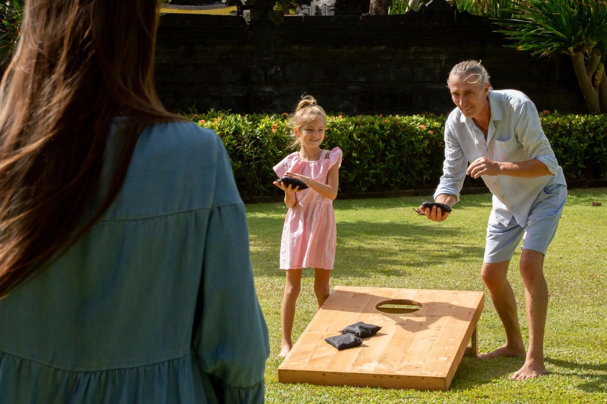 A picture of a family playing pickleball. 