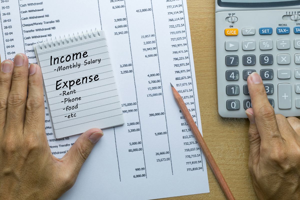 A picture of someone tracking expenses. 