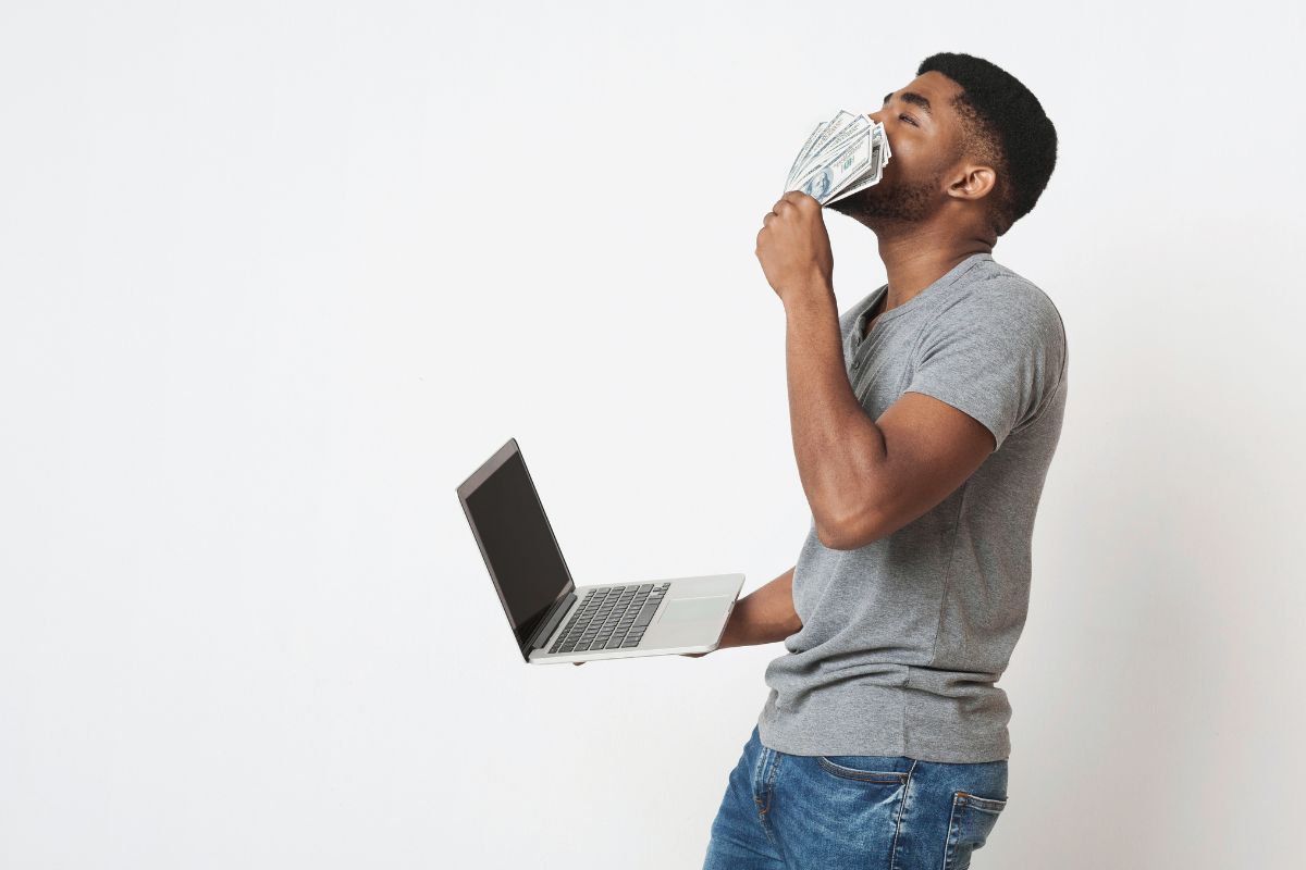 A picture of someone sniffing money. 
