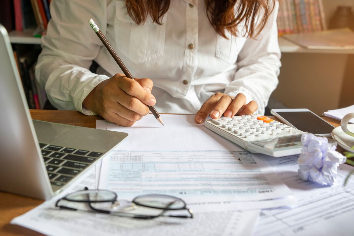 Picture of someone analyzing finances. 