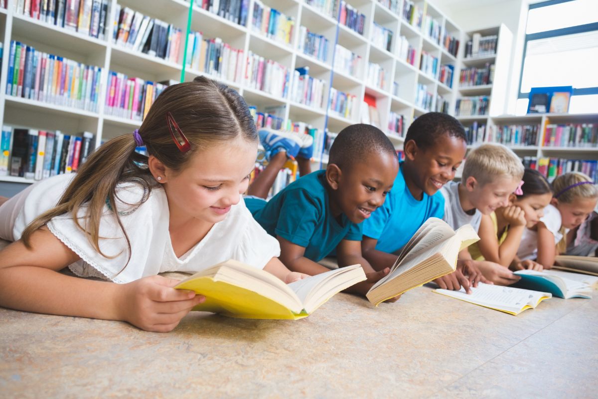 A picture of kids reading at a library.