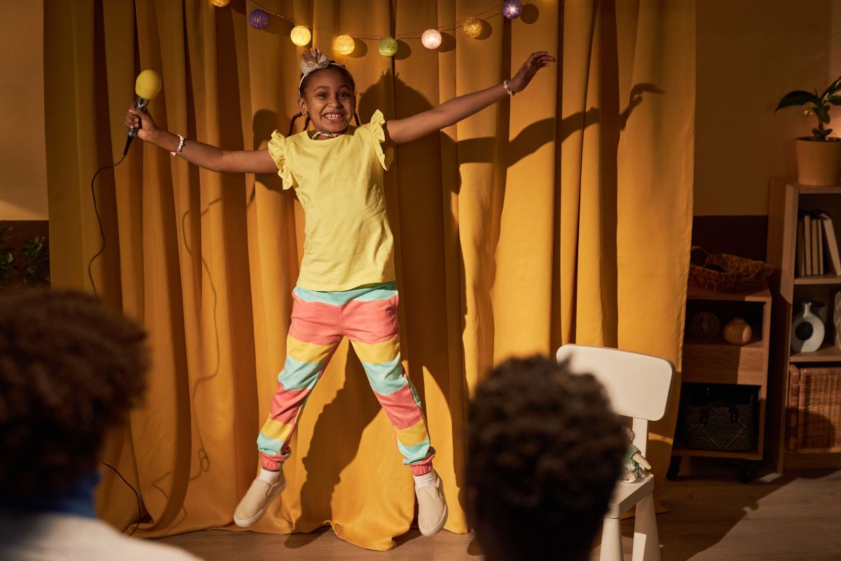 A picture of a kid in a talent show.