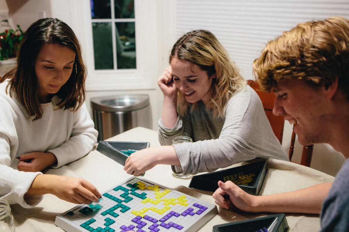 A picture of friends playing board games.
