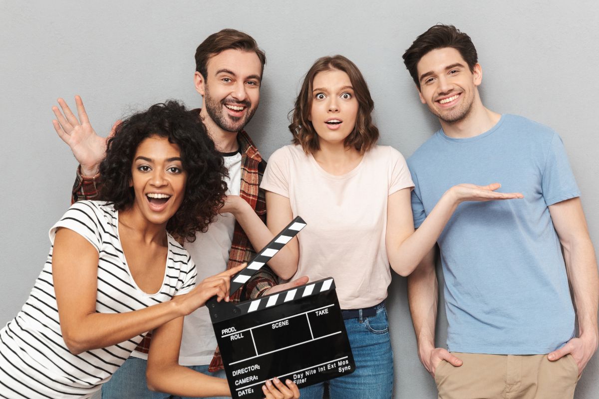 A picture of friends filming something. 