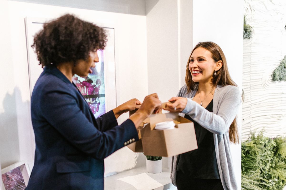 A picture of friends exchanging gifts. 