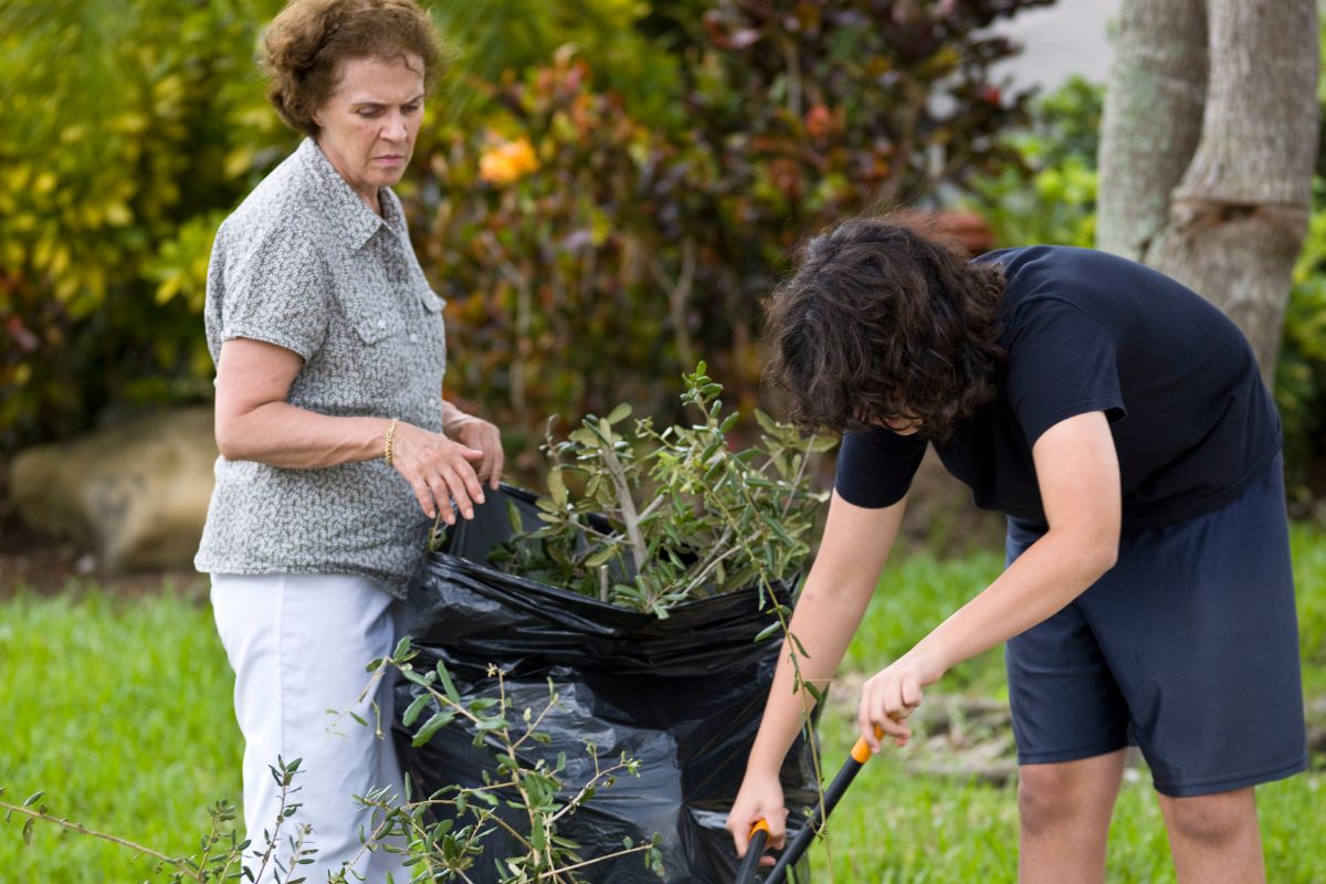 A picture of someone helping an elderly person.