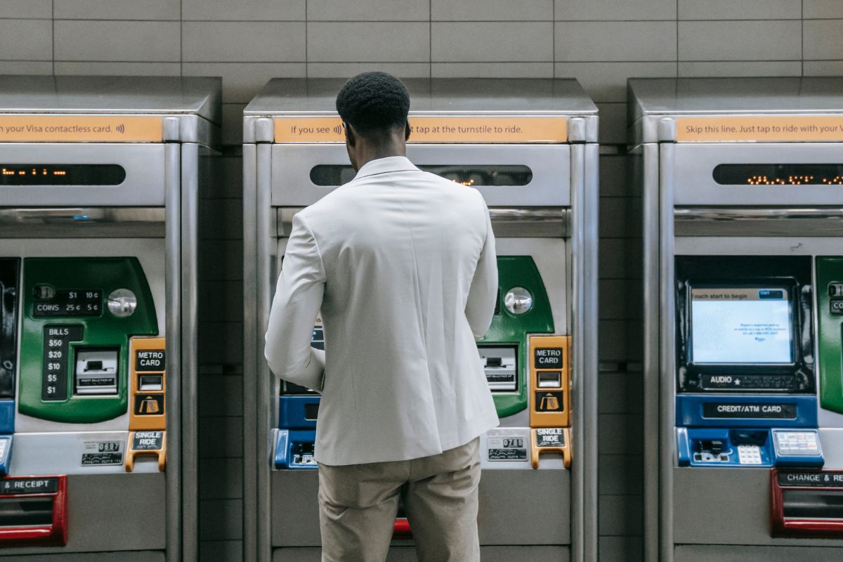 A picture of someone using ATM.