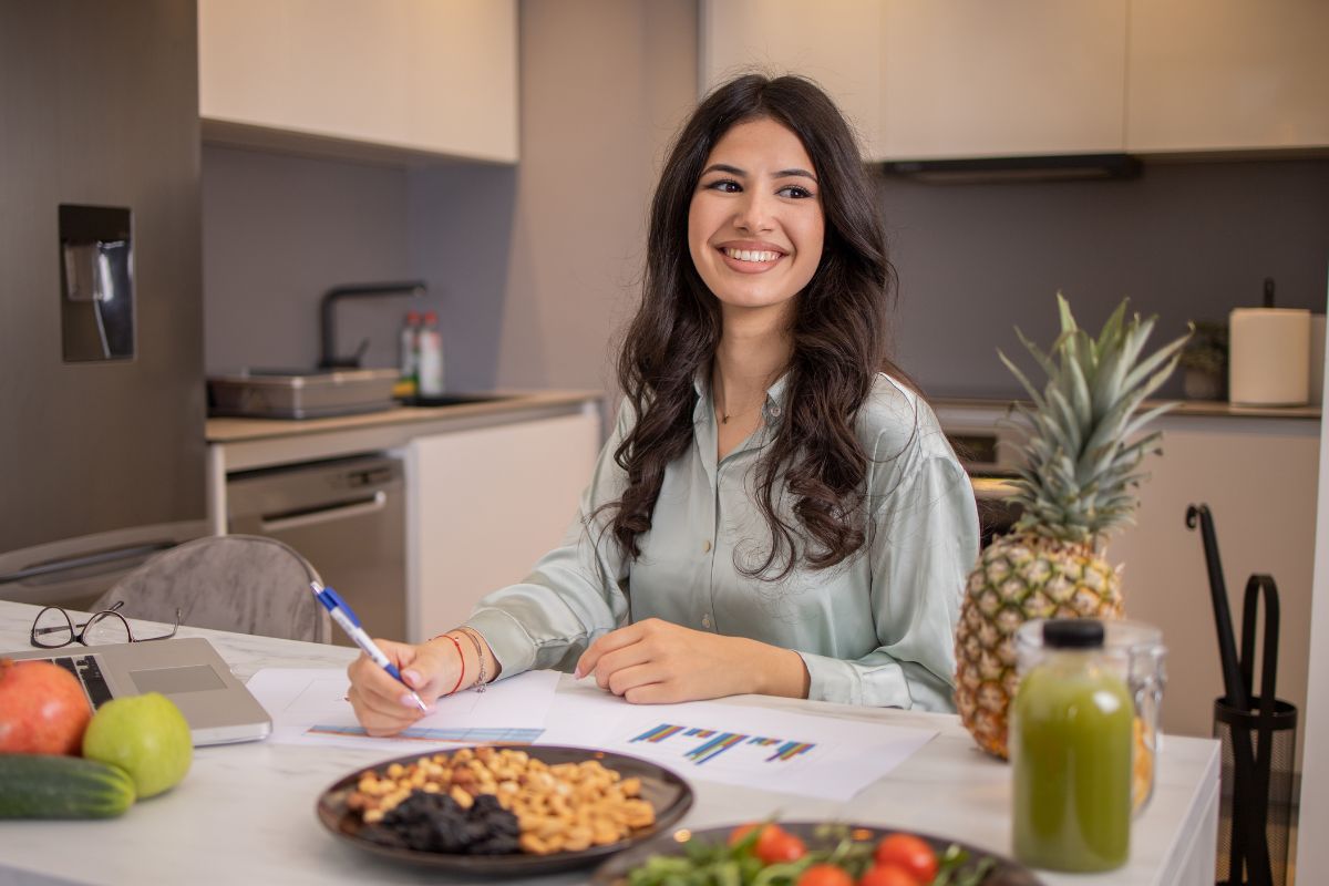 A picture of someone writing down recipes.