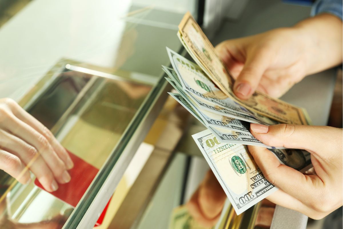 A picture of someone counting their money. 